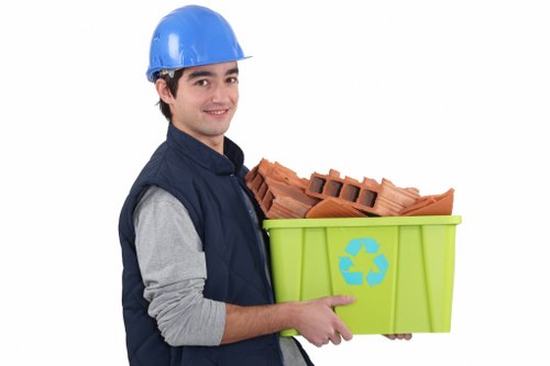 Household waste being loaded into a skip