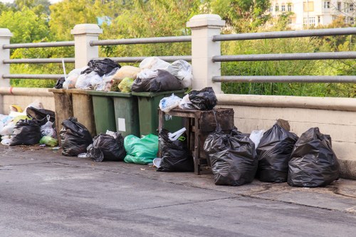 Recycled materials being sorted from skip bin waste in Staines